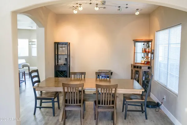 a view of a dining room with furniture and wooden floor