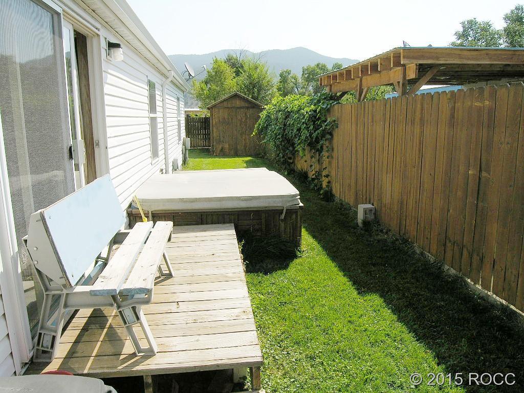 625 Walnut Street Salida, CO 81201 - Photo 13 of 15 a view of a patio with table and chairs with wooden fence
