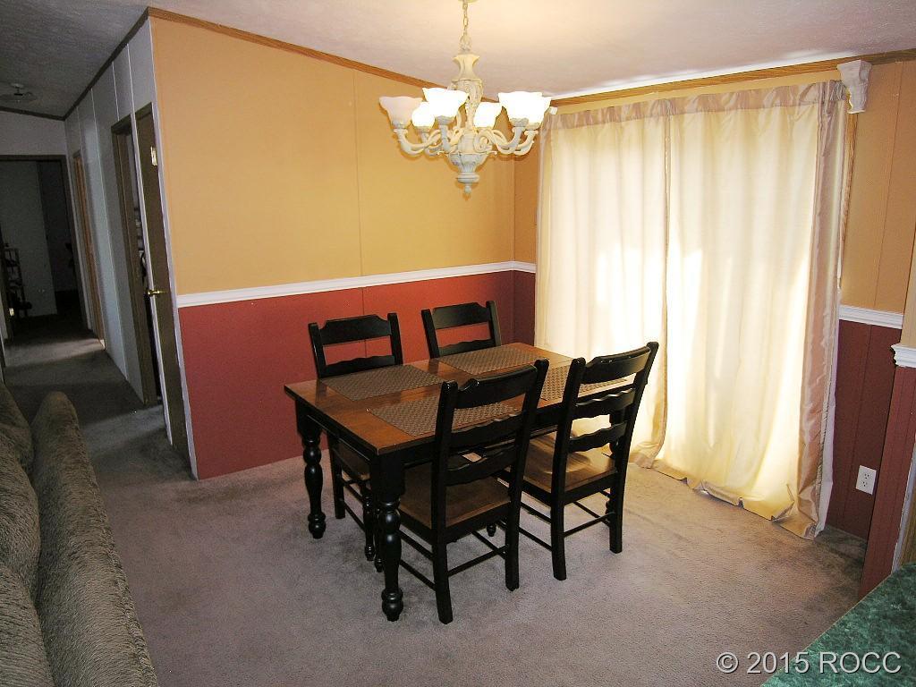 625 Walnut Street Salida, CO 81201 - Photo 4 of 15 a view of a dining room with furniture and a chandelier