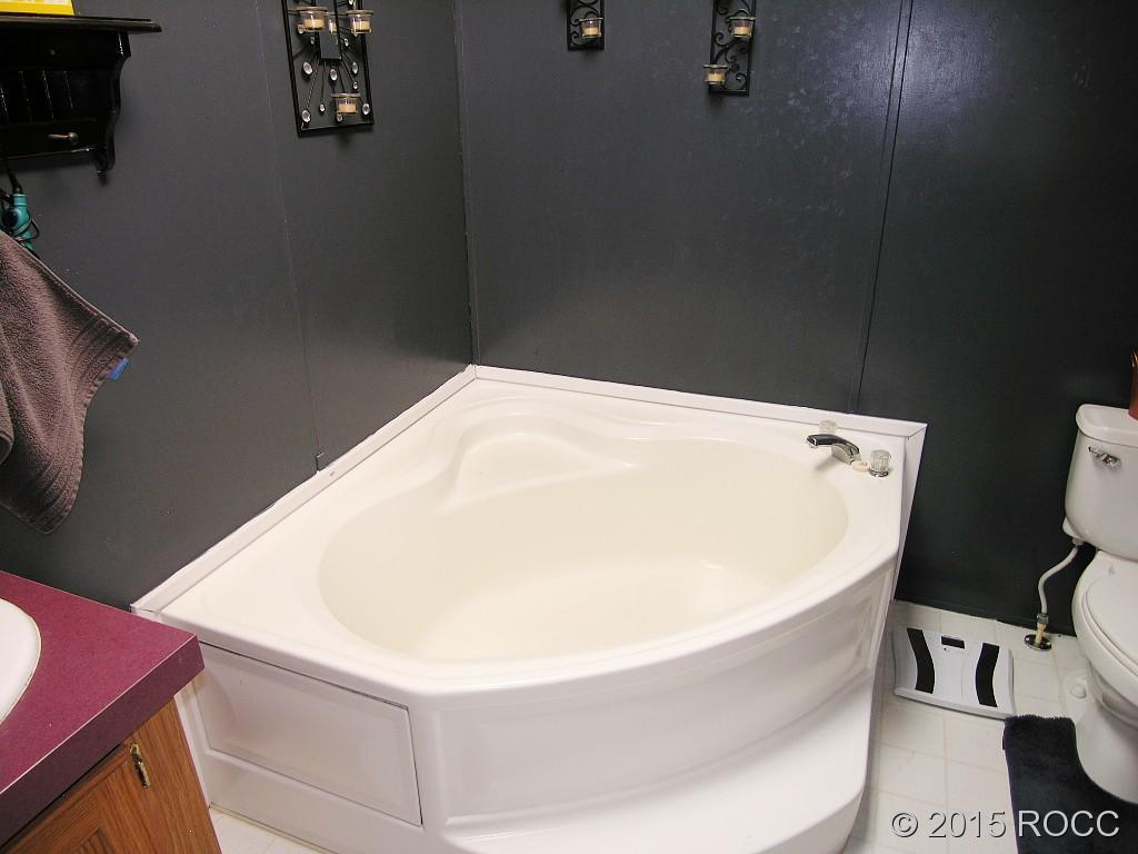 625 Walnut Street Salida, CO 81201 - Photo 8 of 15 a white bath tub sitting next to a white toilet