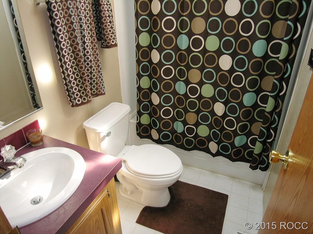 625 Walnut Street Salida, CO 81201 - Photo 10 of 15 a bathroom with a sink toilet and a mirror