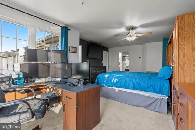 a bedroom with furniture and a window