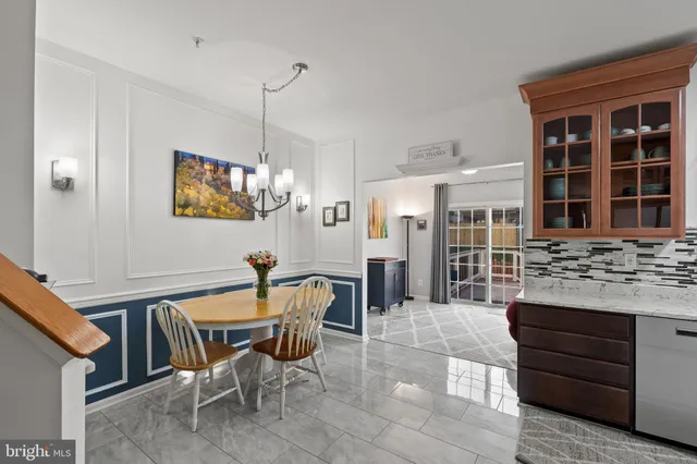 a dining area with furniture and window