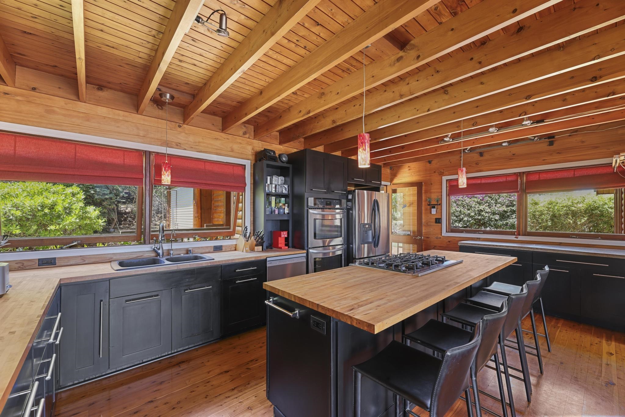 115 Ulua Road Kaunakakai, HI 96748 - Photo 14 of 49 a dining table with chairs and window