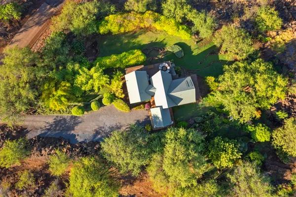 an aerial view of a house with a garden