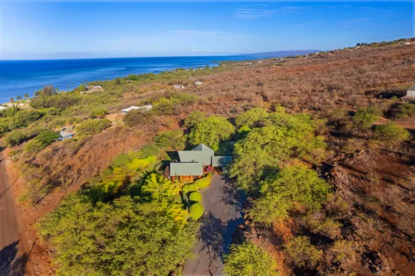 a view of a large body of water with a building in the background