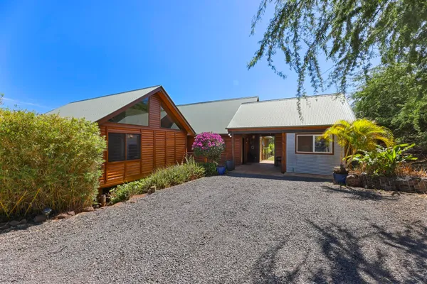 a view of a porch with wooden floor and a yard