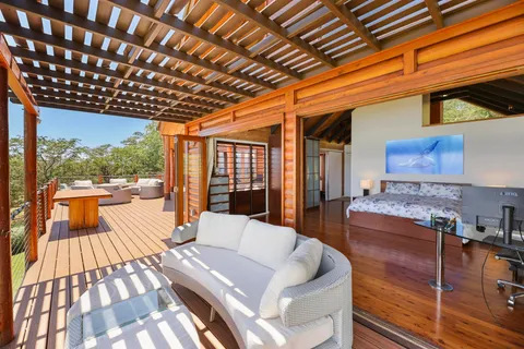 a dining room with furniture and wooden floor