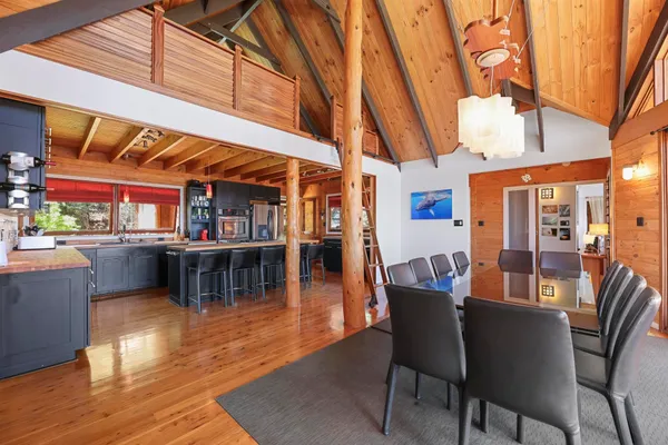 a outdoor living room with furniture and a floor to ceiling window