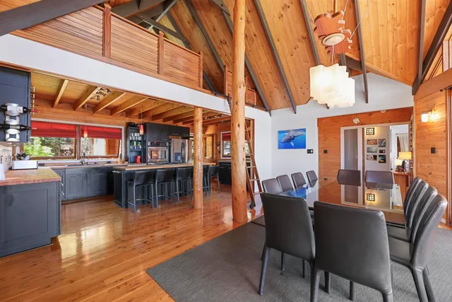 a outdoor living room with furniture and a floor to ceiling window