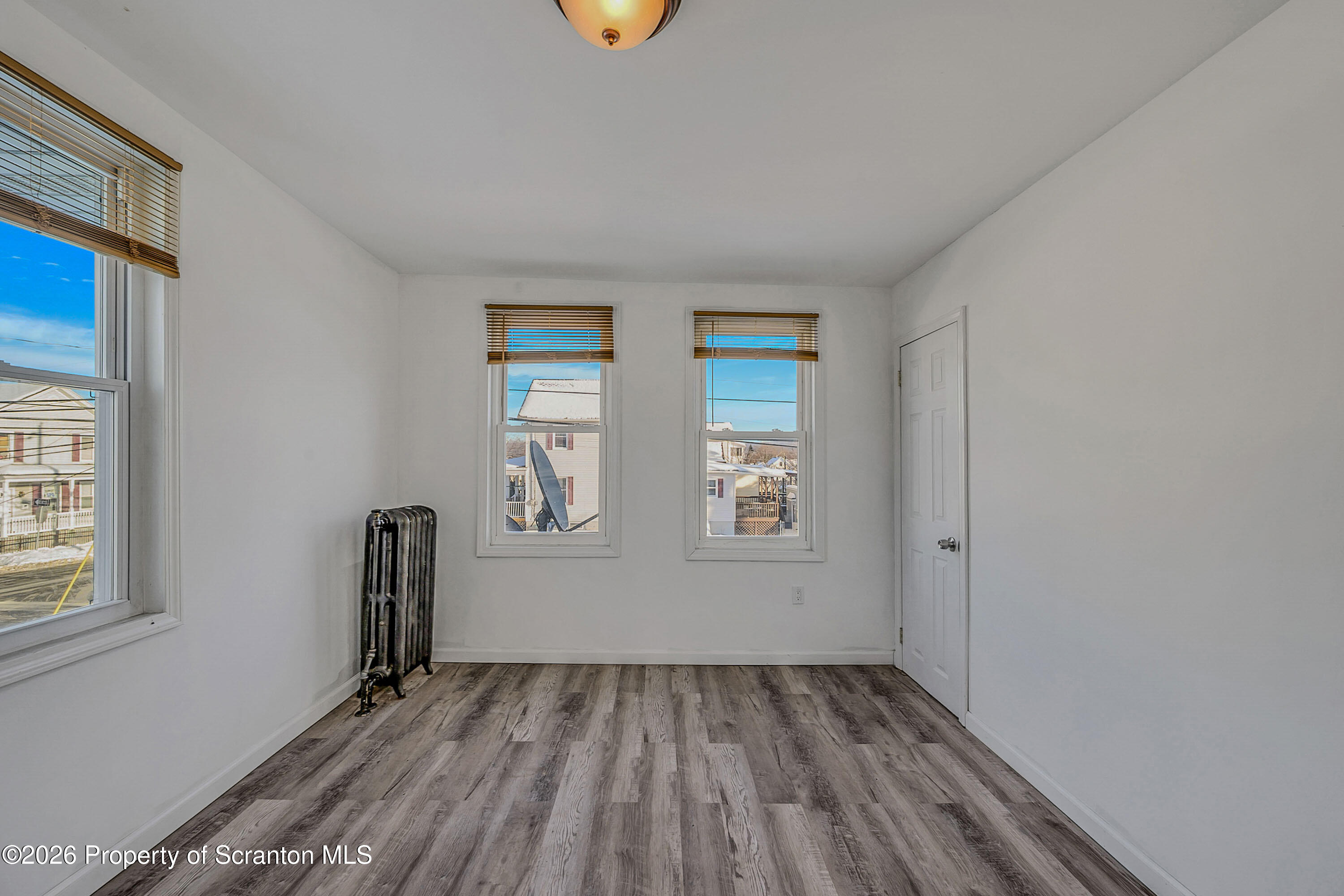 227 North Rebecca Avenue, Unit 2 Scranton, PA 18504 - Photo 7 of 18 an empty room with windows