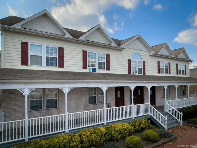 a front view of a house with windows and fence