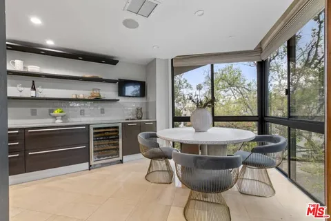 a kitchen with a table and chairs