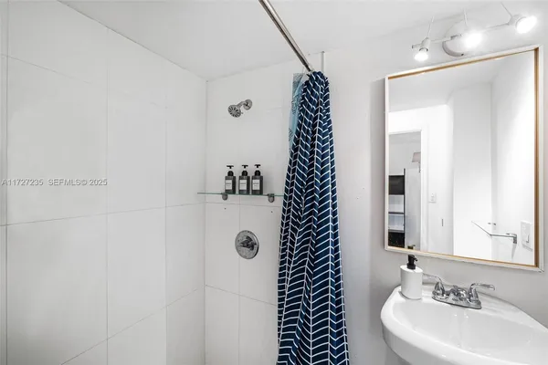 a bathroom with a sink and a mirror