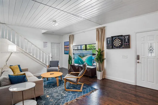 a living room with furniture and a table