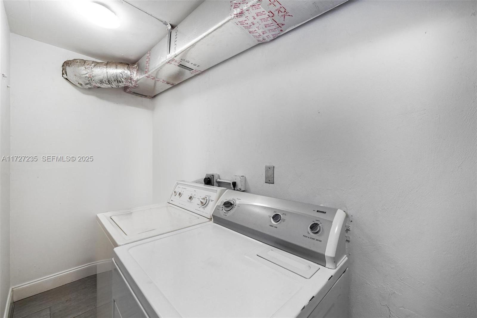 1428 Southwest 11th Terrace Miami, FL 33135 - Photo 22 of 36 a utility room with dryer and washer