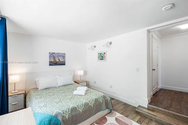 a bedroom with a bed and a cabinets