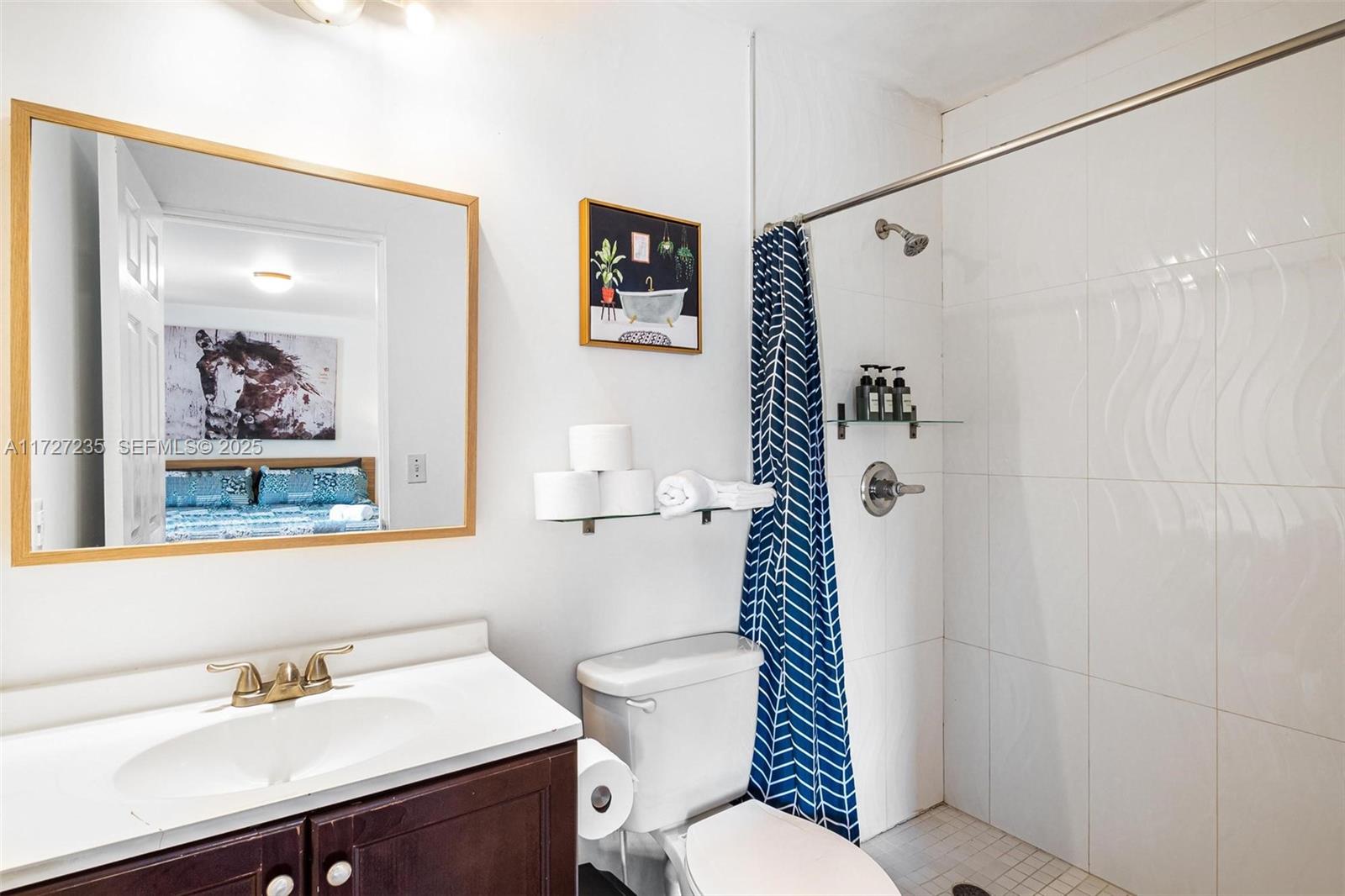 1428 Southwest 11th Terrace Miami, FL 33135 - Photo 28 of 36 a bathroom with a sink toilet and shower