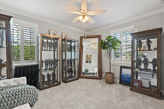 a bedroom with furniture and large window
