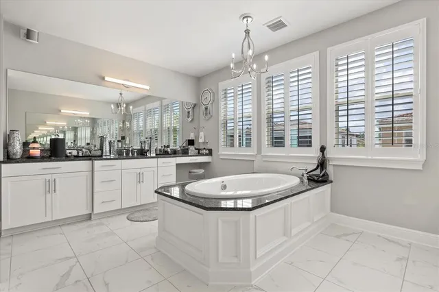 a bathroom with a sink a mirror and a bathtub