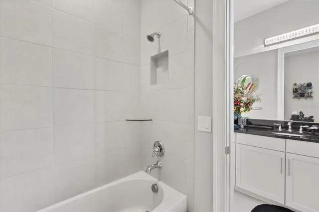 a bathroom with a bathtub and a sink