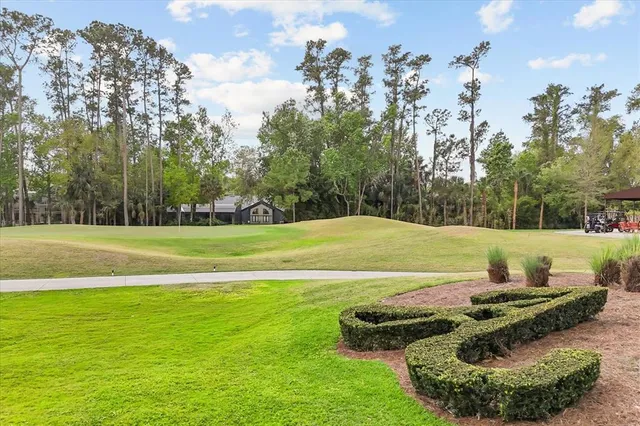 a view of a golf course with a swimming pool