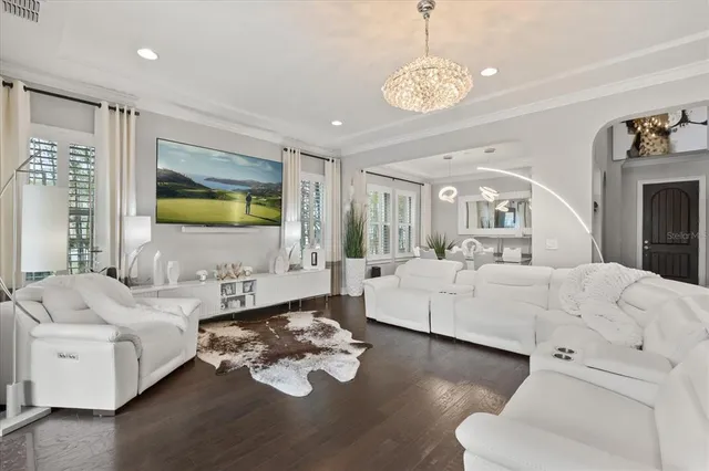 a bed room with furniture and a chandelier