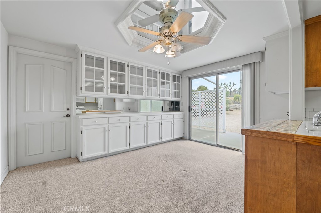 57622 Sierra Way Yucca Valley, CA 92284 - Photo 12 of 55 a view of a livingroom with a chandelier fan and windows