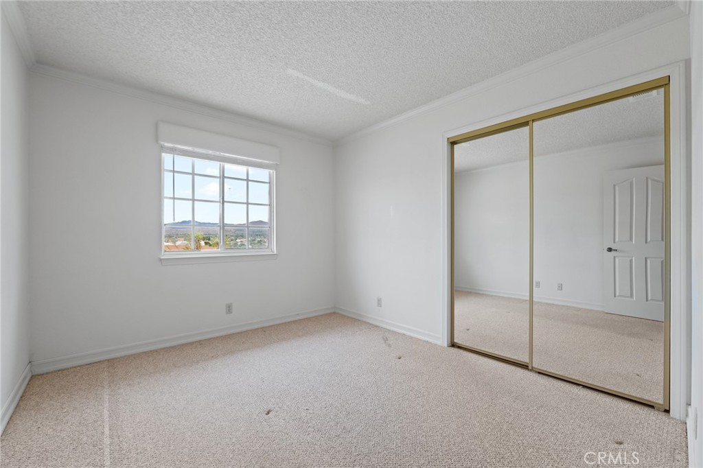 57622 Sierra Way Yucca Valley, CA 92284 - Photo 17 of 55 an empty room with windows