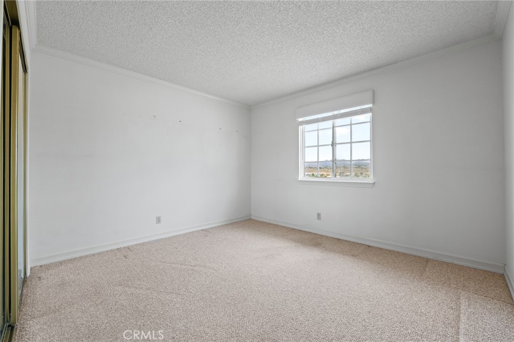 57622 Sierra Way Yucca Valley, CA 92284 - Photo 18 of 55 an empty room with a window