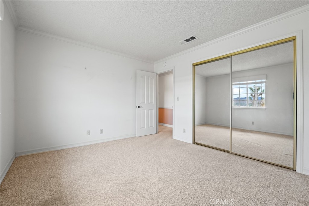 57622 Sierra Way Yucca Valley, CA 92284 - Photo 19 of 55 a view of an empty room with a window