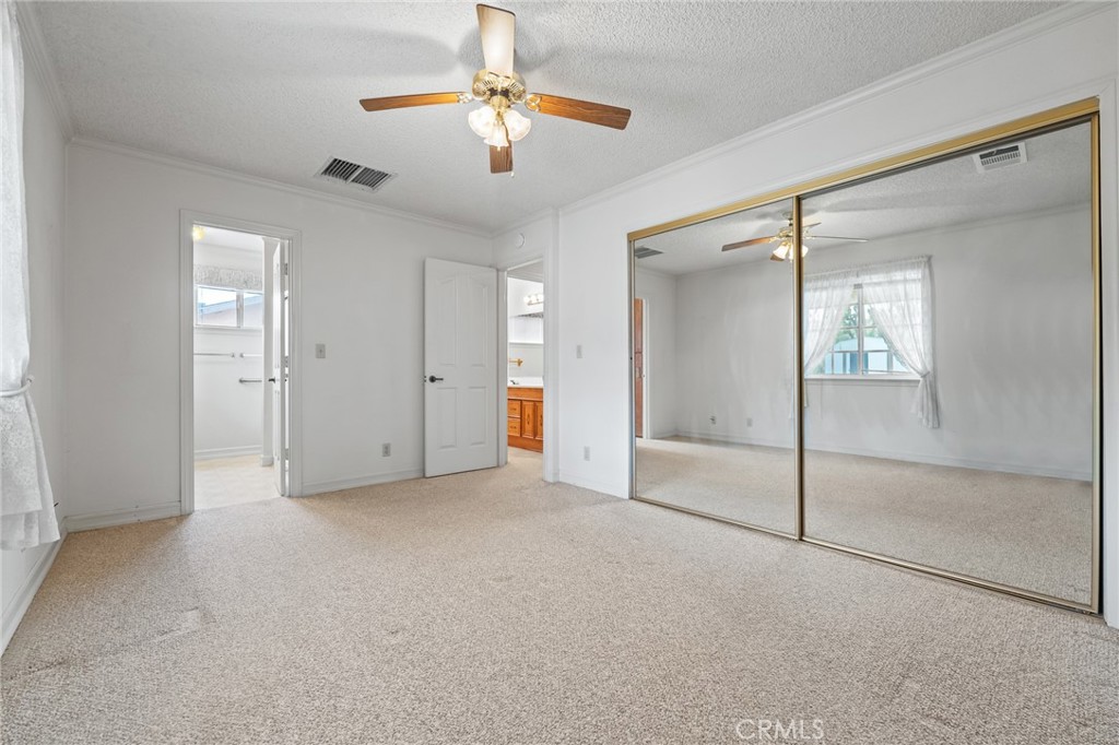57622 Sierra Way Yucca Valley, CA 92284 - Photo 23 of 55 an empty room with fan and entrance