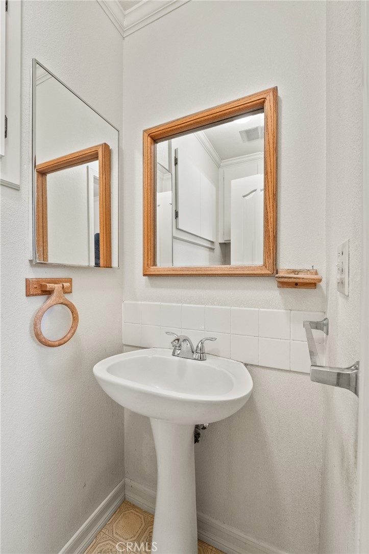 57622 Sierra Way Yucca Valley, CA 92284 - Photo 26 of 55 a bathroom with a sink and a mirror