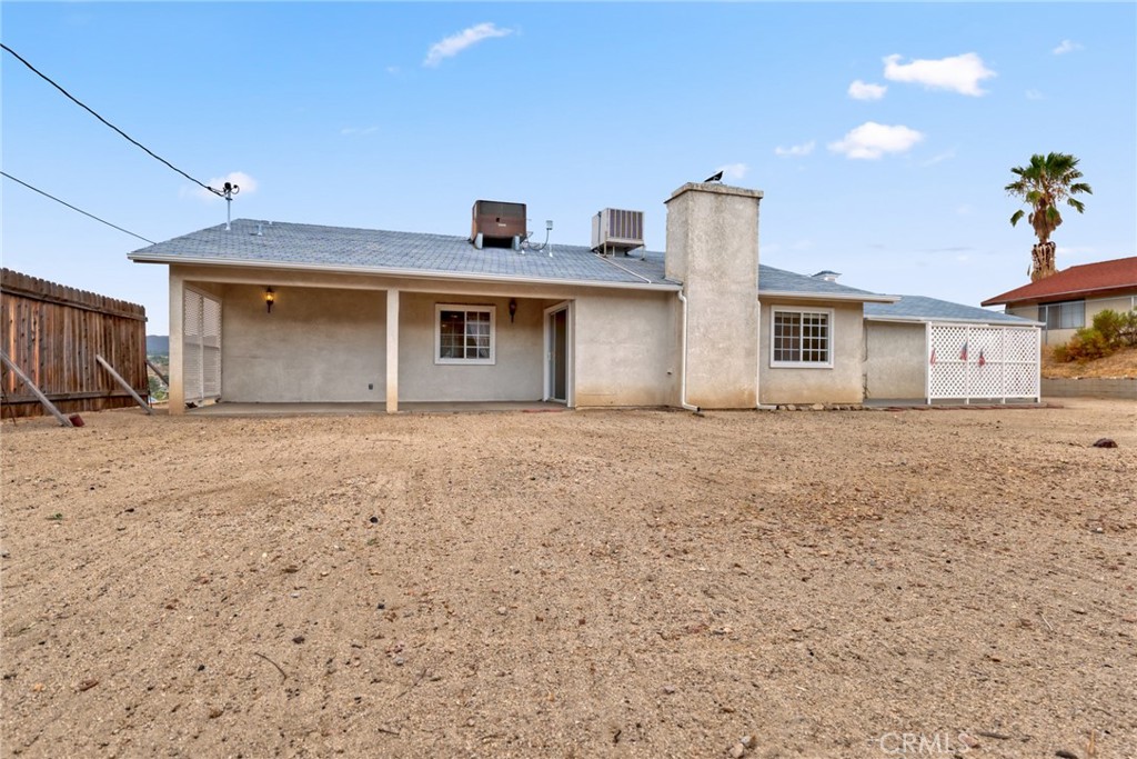 57622 Sierra Way Yucca Valley, CA 92284 - Photo 36 of 55 a front view of a house with a yard