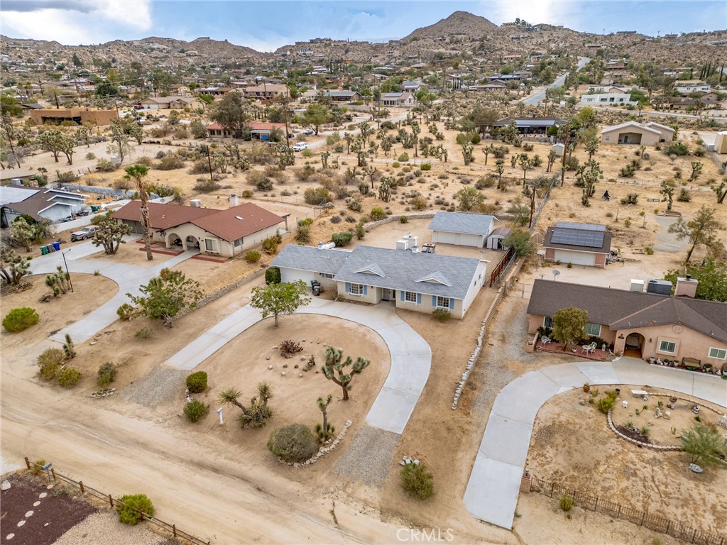 57622 Sierra Way Yucca Valley, CA 92284 - Photo 41 of 55 an aerial view of a house with a mountain