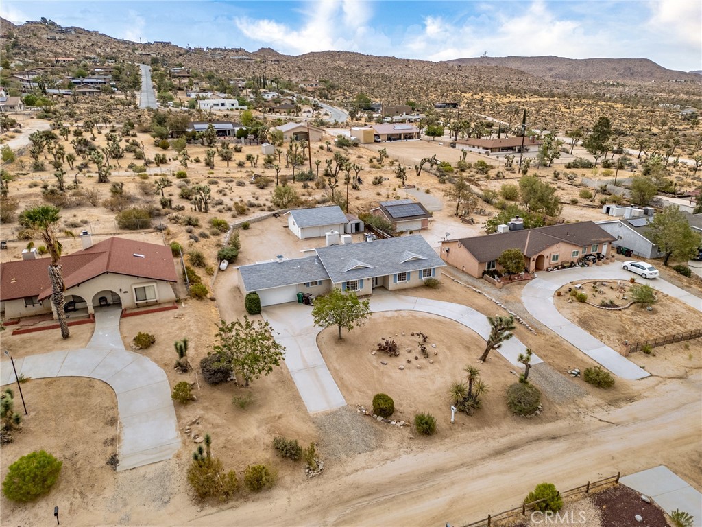 57622 Sierra Way Yucca Valley, CA 92284 - Photo 42 of 55 an aerial view of residential houses with outdoor space