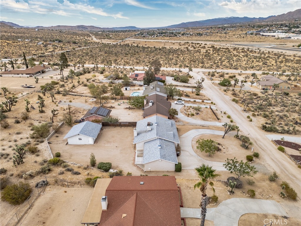 57622 Sierra Way Yucca Valley, CA 92284 - Photo 44 of 55 an aerial view of residential houses with outdoor space