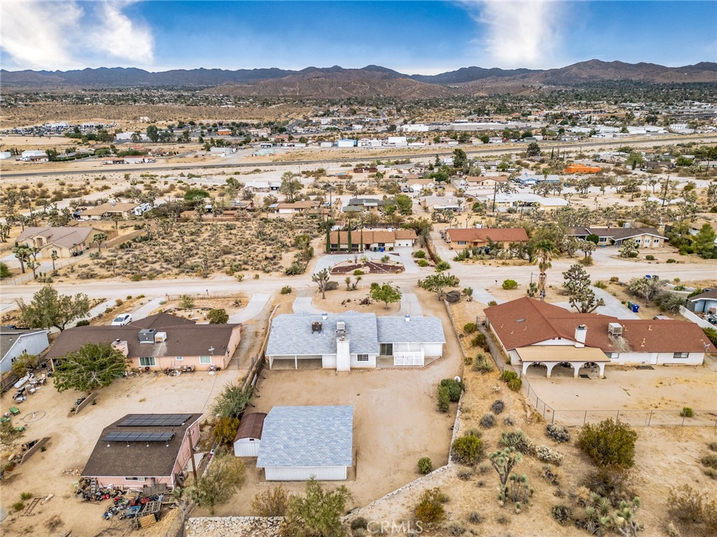 57622 Sierra Way Yucca Valley, CA 92284 - Photo 47 of 55 an aerial view of residential houses with outdoor space