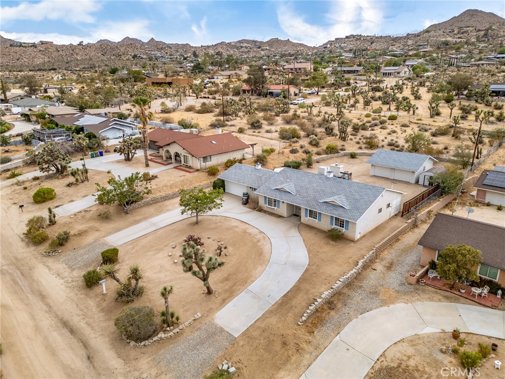 57622 Sierra Way Yucca Valley, CA 92284 - Photo 50 of 55 an aerial view of a house with a swimming pool