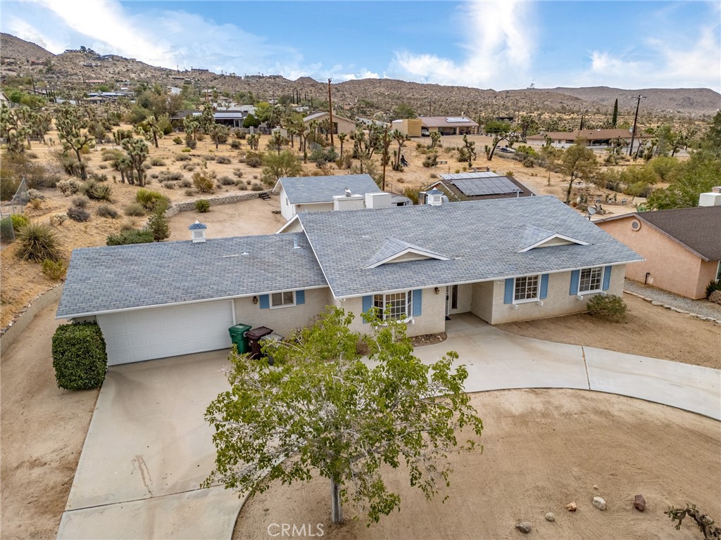 57622 Sierra Way Yucca Valley, CA 92284 - Photo 52 of 55 an aerial view of residential houses with city view