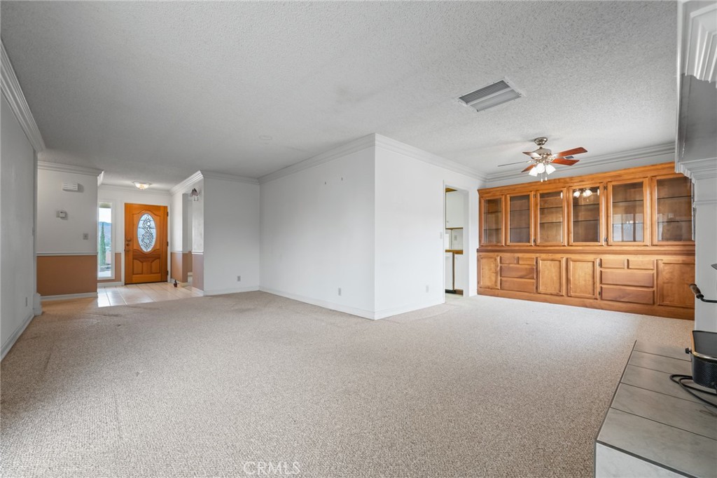 57622 Sierra Way Yucca Valley, CA 92284 - Photo 6 of 55 a view of a big room with windows and entryway