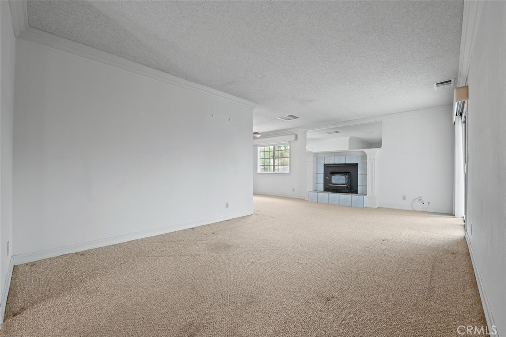 57622 Sierra Way Yucca Valley, CA 92284 - Photo 7 of 55 a view of empty room with a fireplace