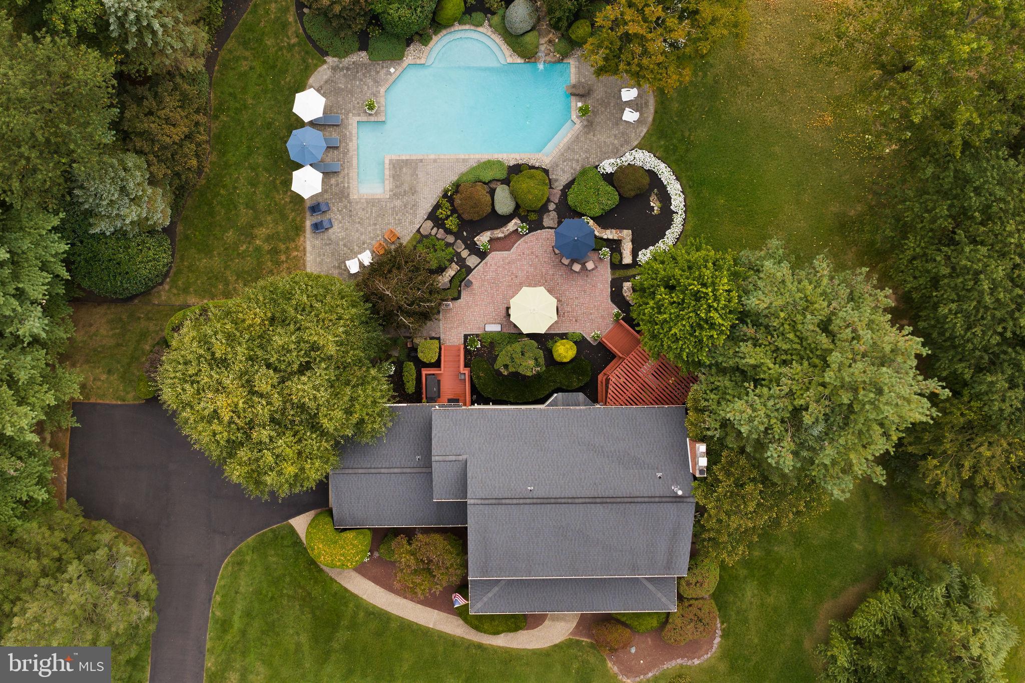 44 Walters Road Robbinsville, NJ 08691 - Photo 11 of 68 an aerial view of a house with a swimming pool and large trees