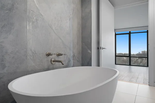 a white bath tub sitting in a bathroom