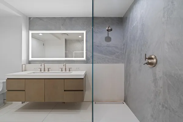 a bathroom with a sink and mirror