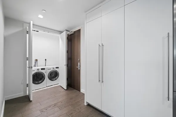 a view of a storage & utility room with a washer and dryer