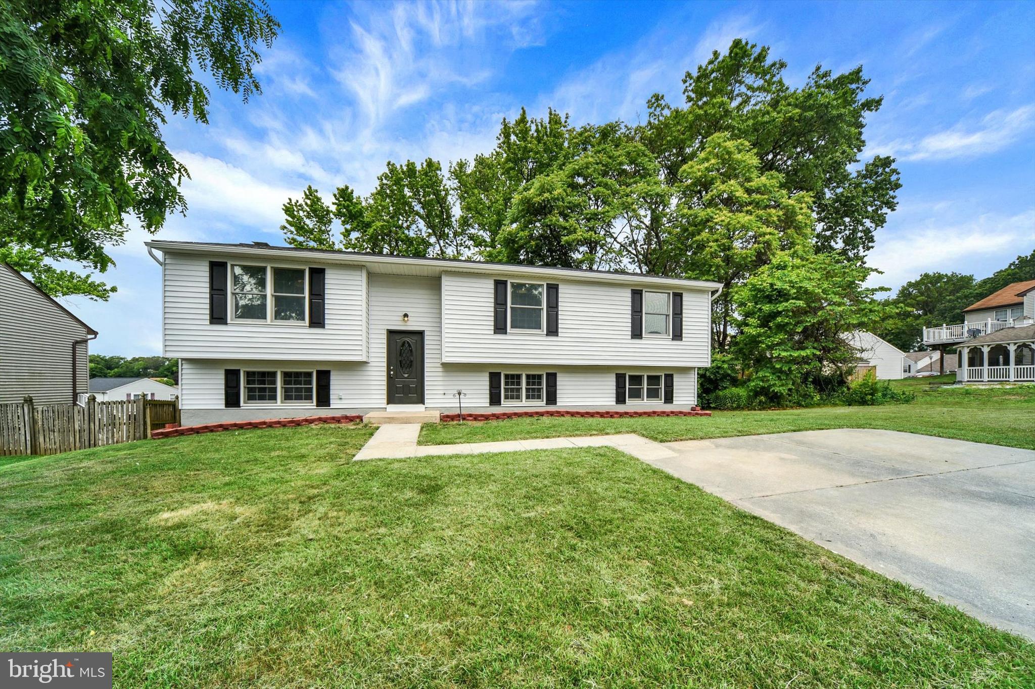 220 Sandhill Road Baltimore, MD 21221 - Photo 2 of 30 a front view of a house with a garden