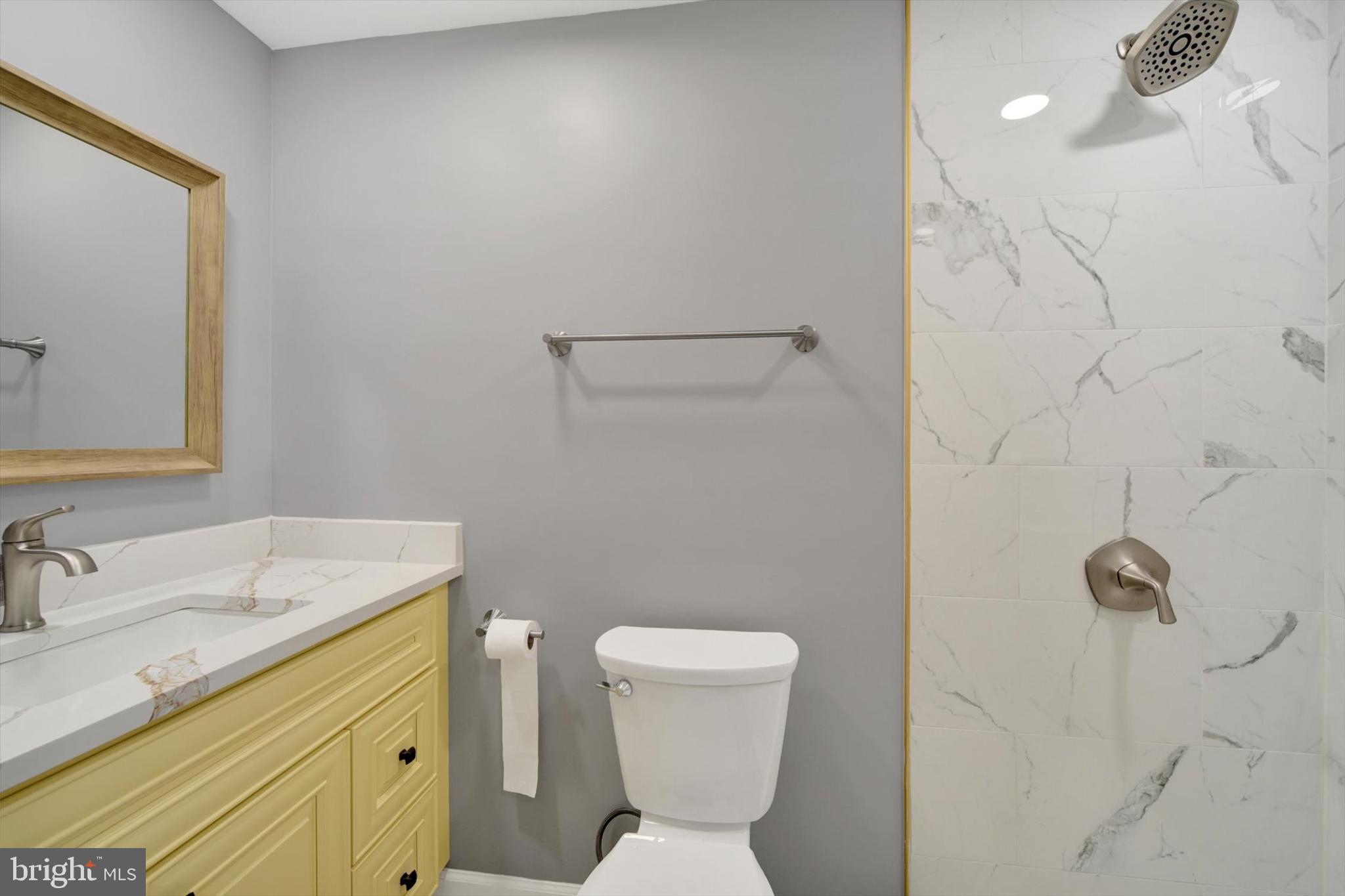 220 Sandhill Road Baltimore, MD 21221 - Photo 21 of 30 a bathroom with a sink toilet and vanity