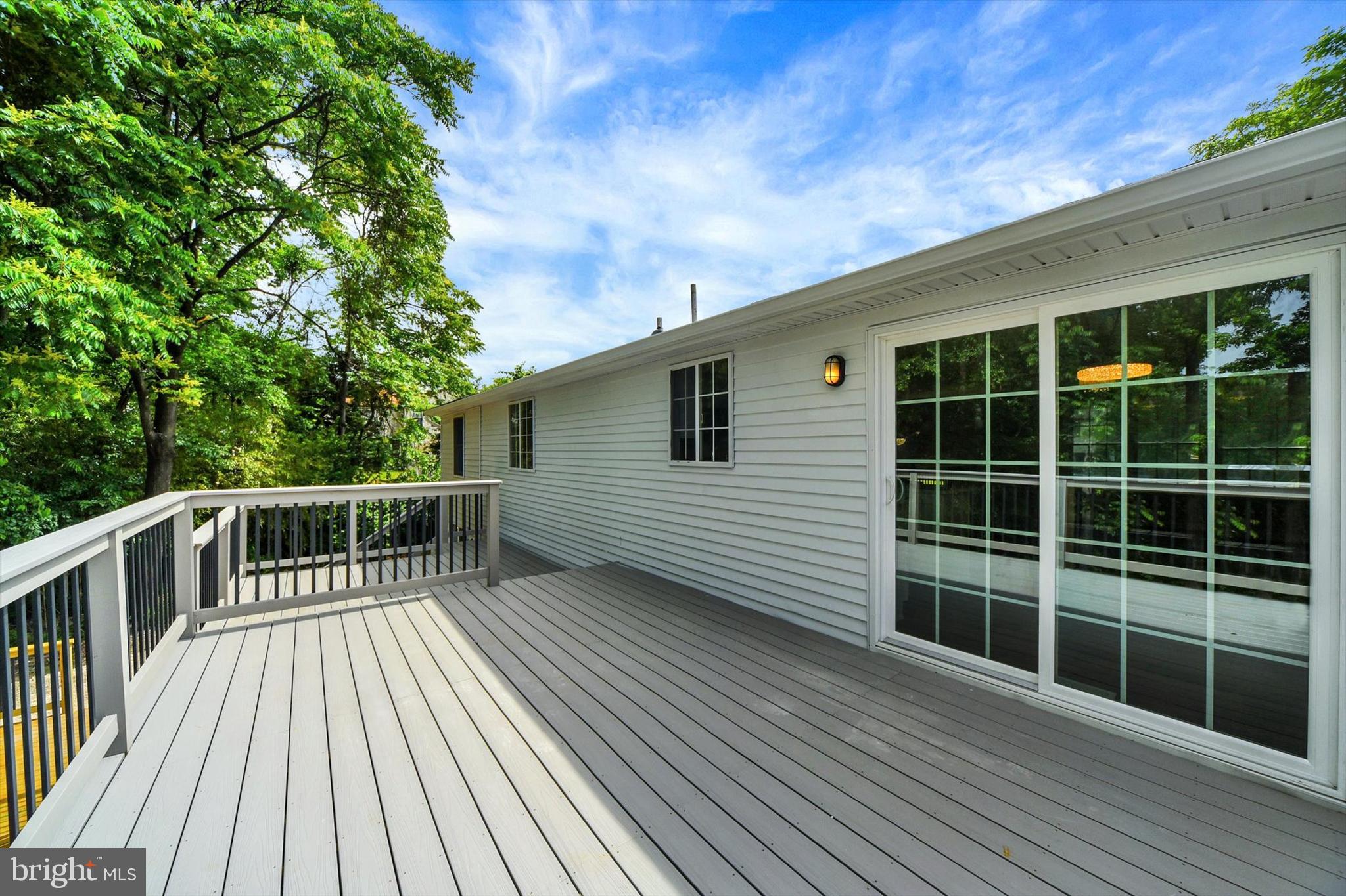 220 Sandhill Road Baltimore, MD 21221 - Photo 24 of 30 a balcony with wooden floor and fence