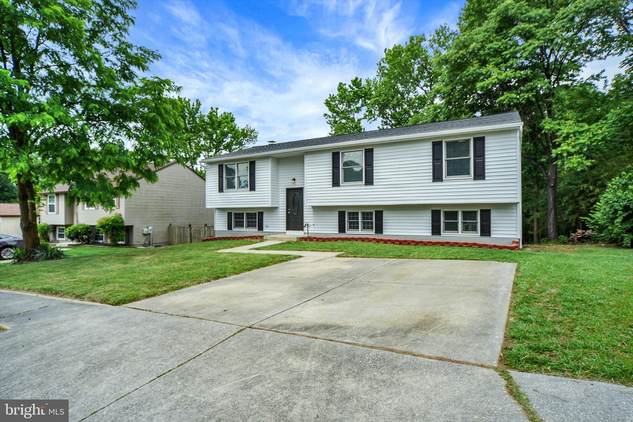 220 Sandhill Road Baltimore, MD 21221 - Photo 3 of 30 a view of a house with a yard and a tree